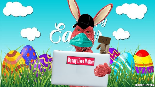 Pink rabbit using a silver laptop.